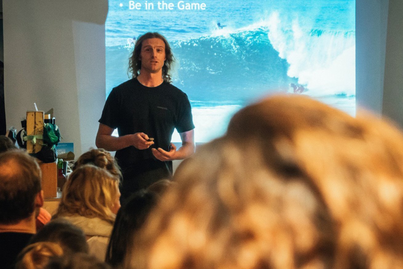 big wave surfing against plastics
